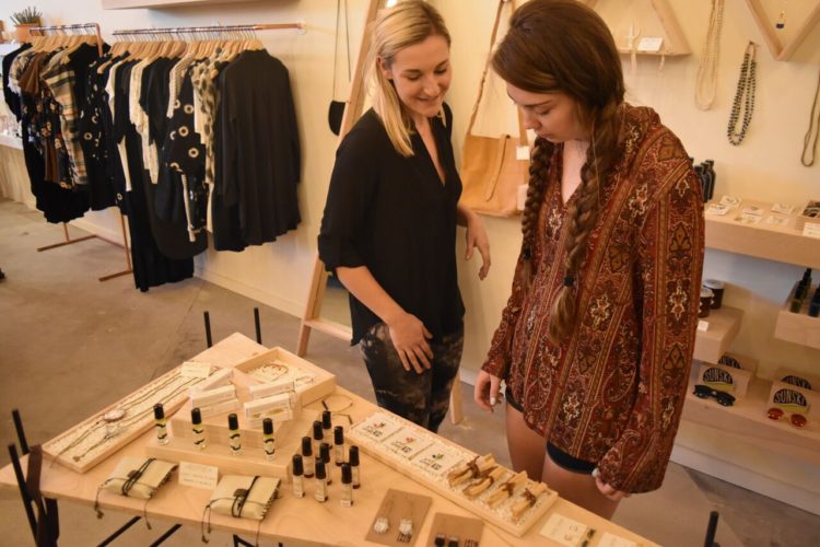 Shoppers admire jewelry at Local Nomad. Photo: Local Nomad